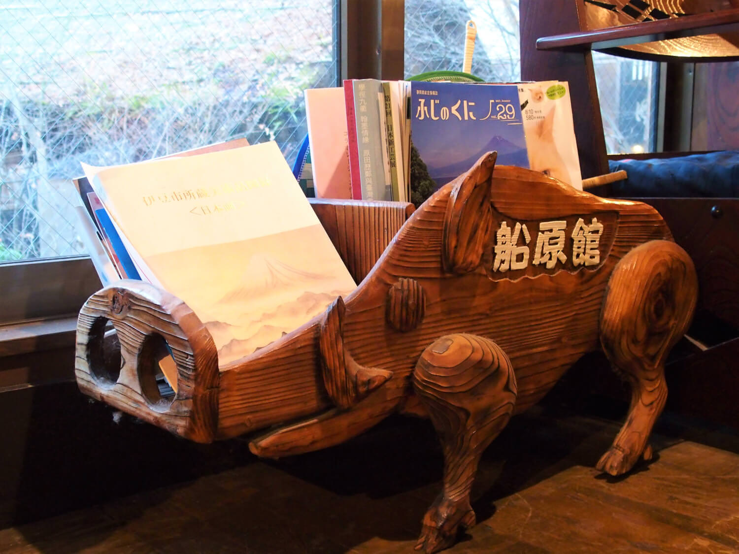 A book stand shaped like a boar