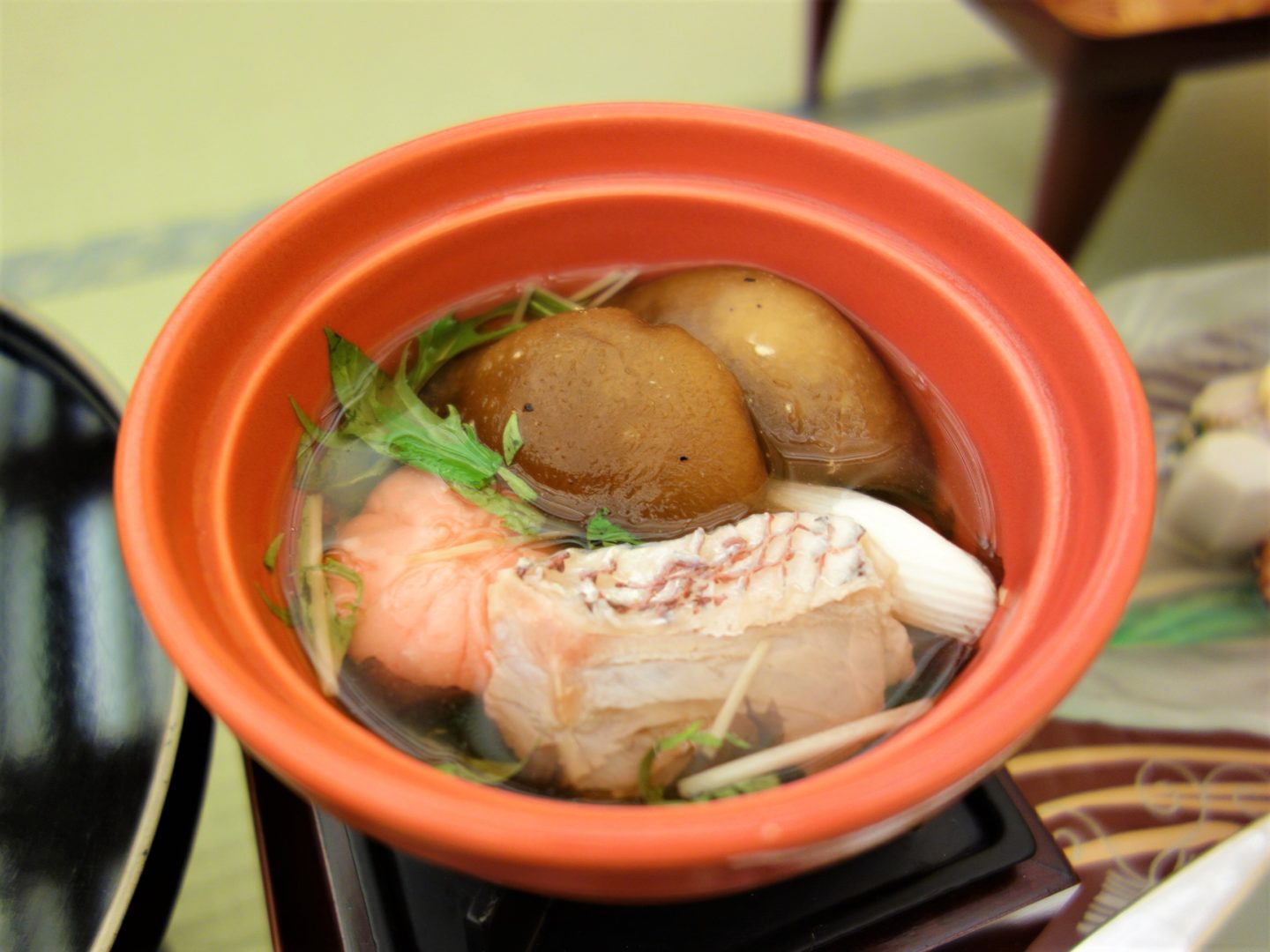 A soup with sea bream, seaweed, vegetables and shrimp mochi